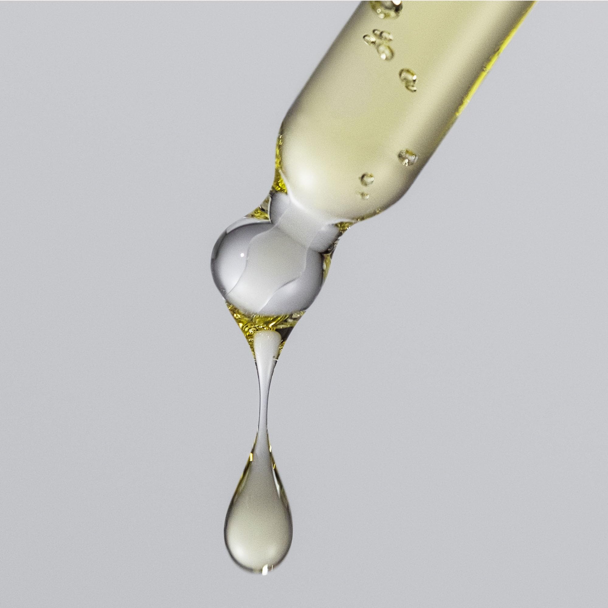 Living Proof No Frizz Vanishing Oil travel-size bottle for on-the-go styling.