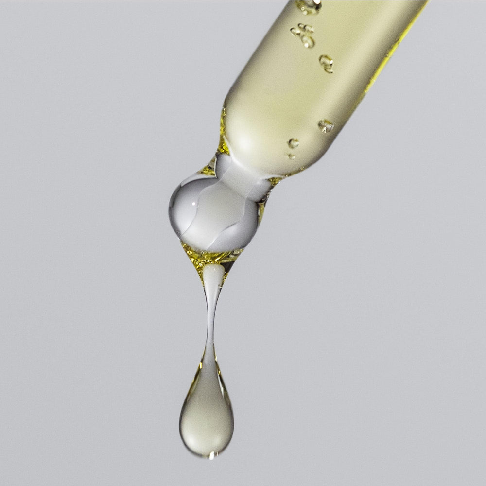 Living Proof No Frizz Vanishing Oil travel-size bottle for on-the-go styling.