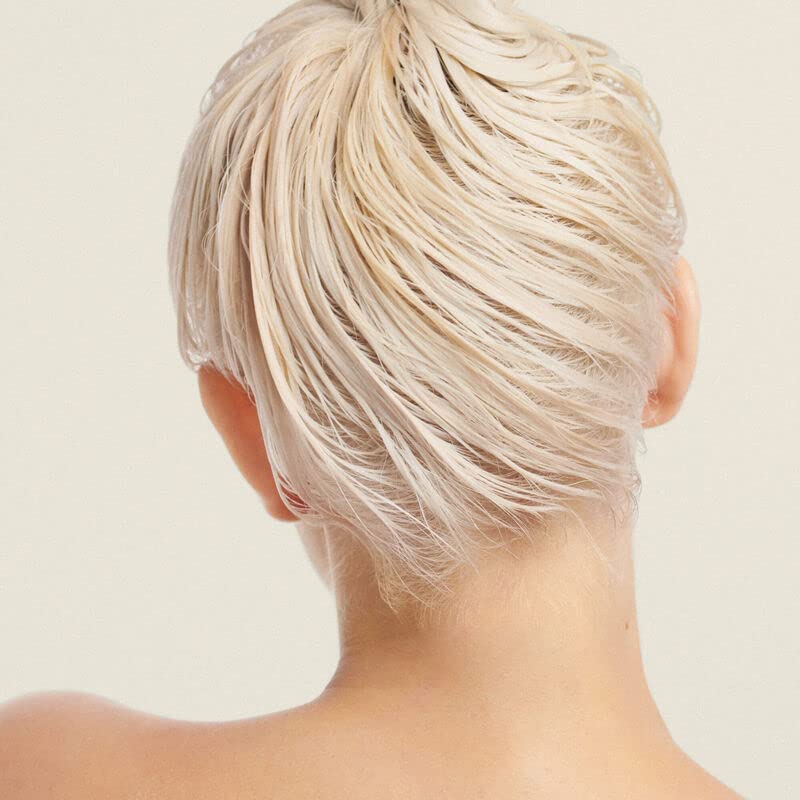 Living Proof Restore Repair Mask applying-to-hair scene hints quick pampering for stronger strands.