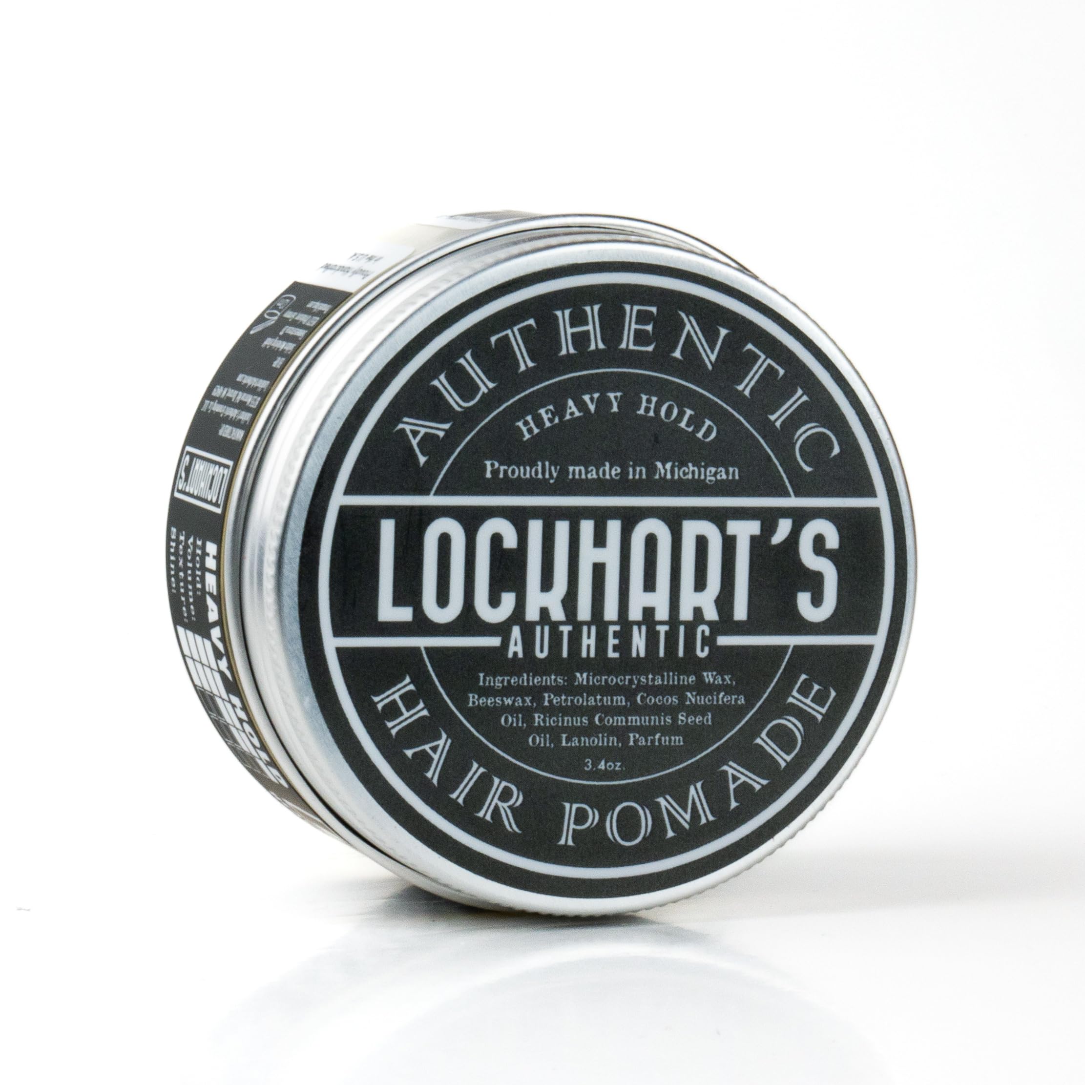 Lockhart's Heavy Hold pomade tin packaging on wood surface for premium styling control