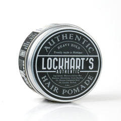 Lockhart's Heavy Hold pomade tin packaging on wood surface for premium styling control