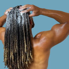 LOCssentials clarifying shampoo scalp massage shot highlights cooling menthol and peppermint sensations during wash.