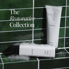 LolaVie Restorative Conditioner bottle delivers silky softness and reduces damage.