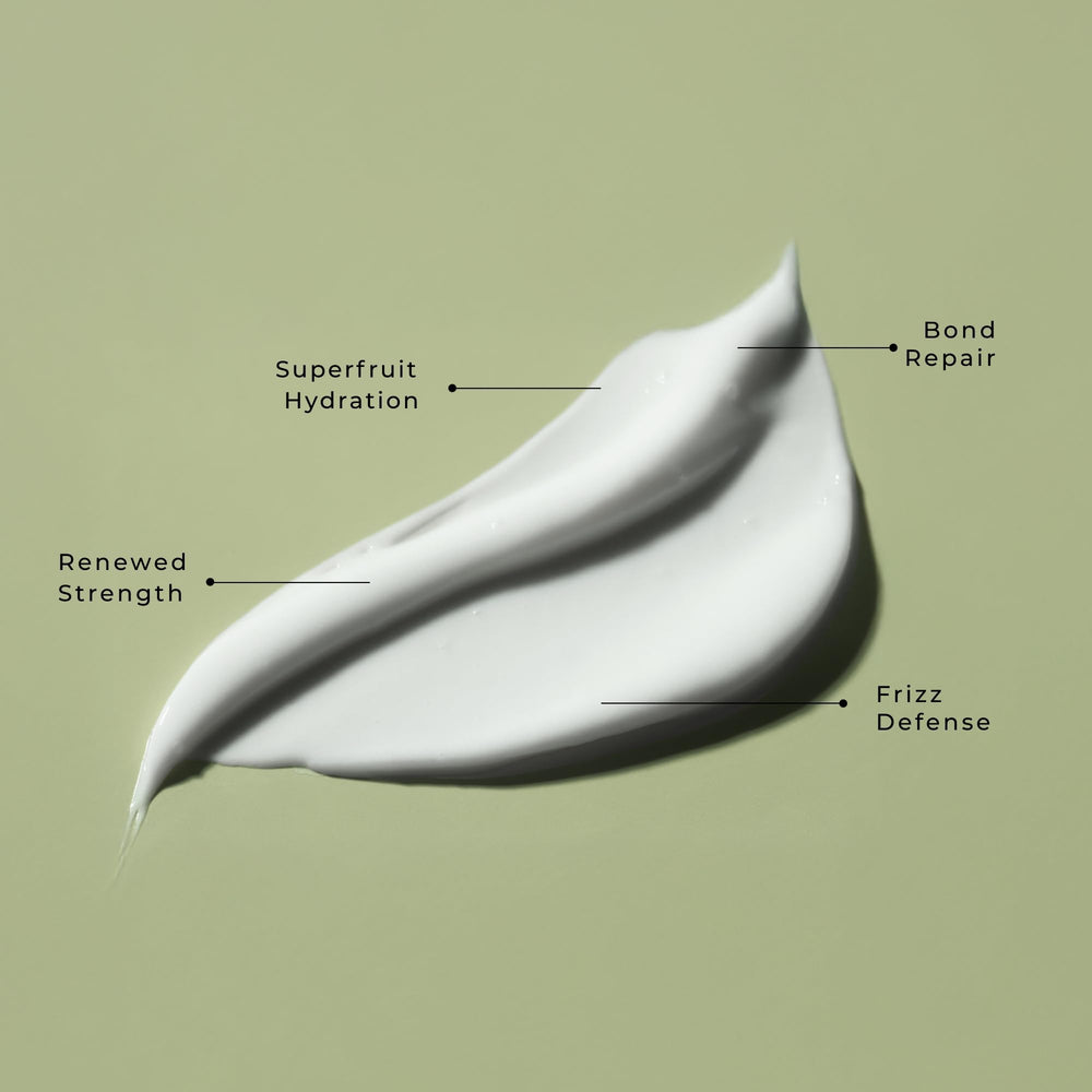 LolaVie Restorative Conditioner label closeup showing vegan, color-safe formula.