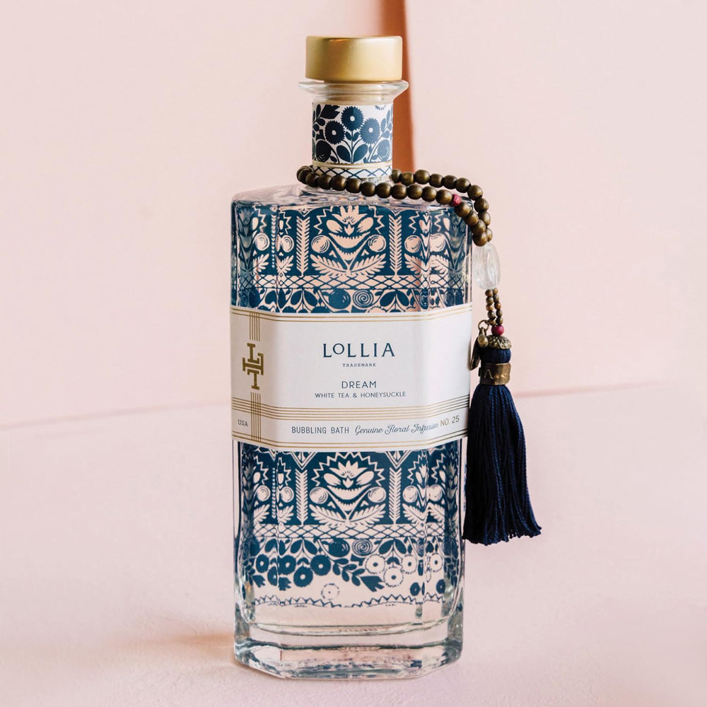 Lollia Dream Bubble Bath close-up bottle highlighting avocado oil formula for moisture.