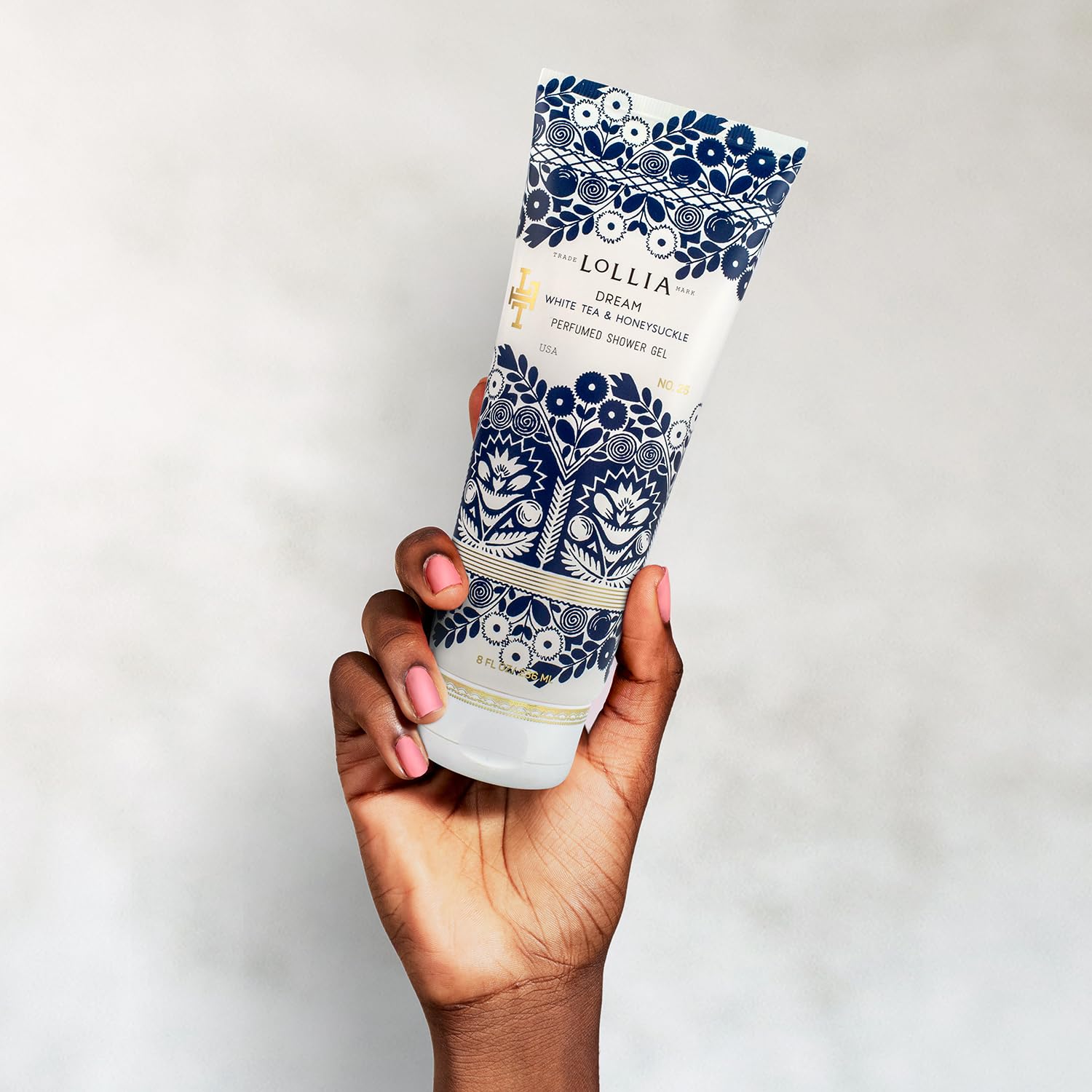 LOLLIA Dream Shower Gel packaging details with blue florals and metallic accents