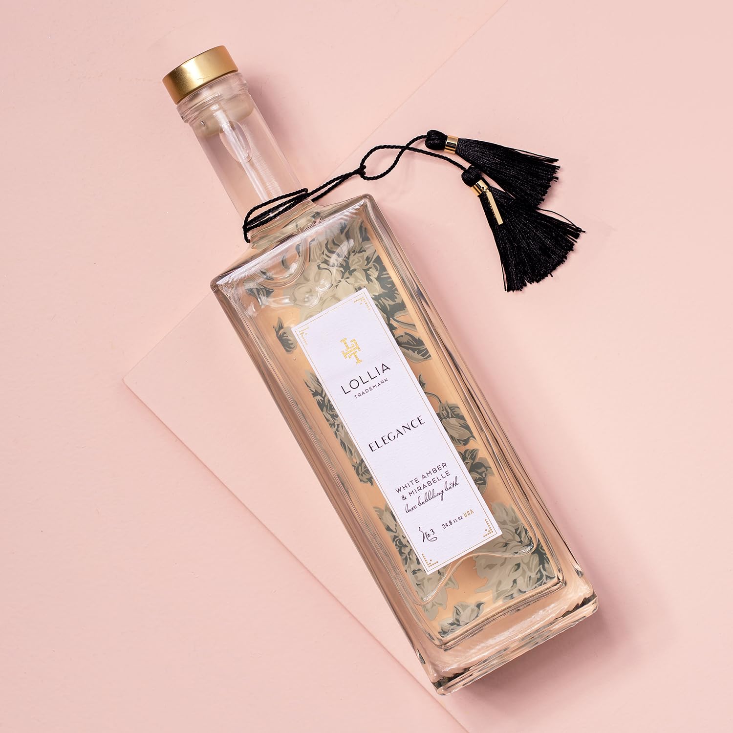 LOLLIA Elegance bubbles foaming in tub for a soothing, skin-softening bath experience.