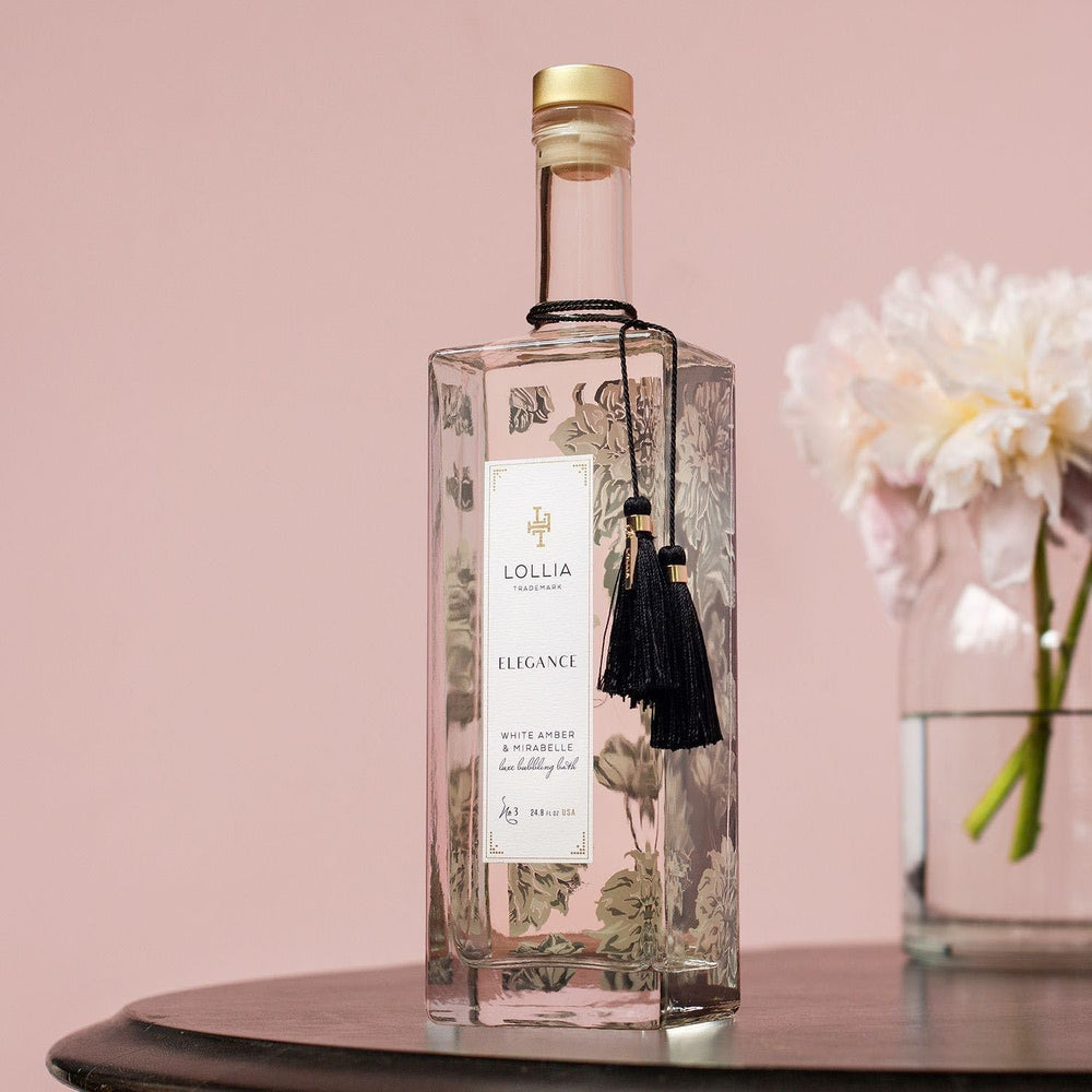 LOLLIA Elegance bubble bath on a serene tub-side setting for a luxurious spa moment.