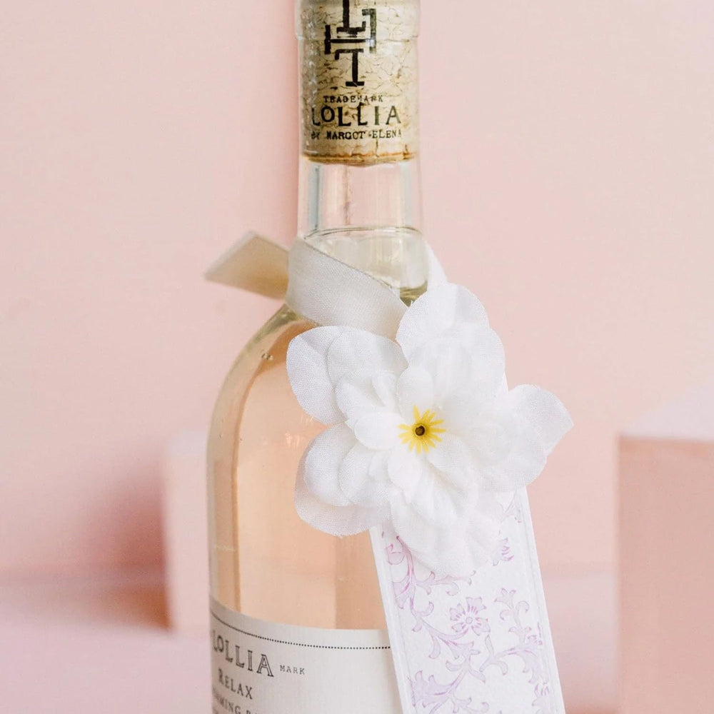 Lollia Relax moisturizing oil blend bottle with avocado and vitamin E nourishment