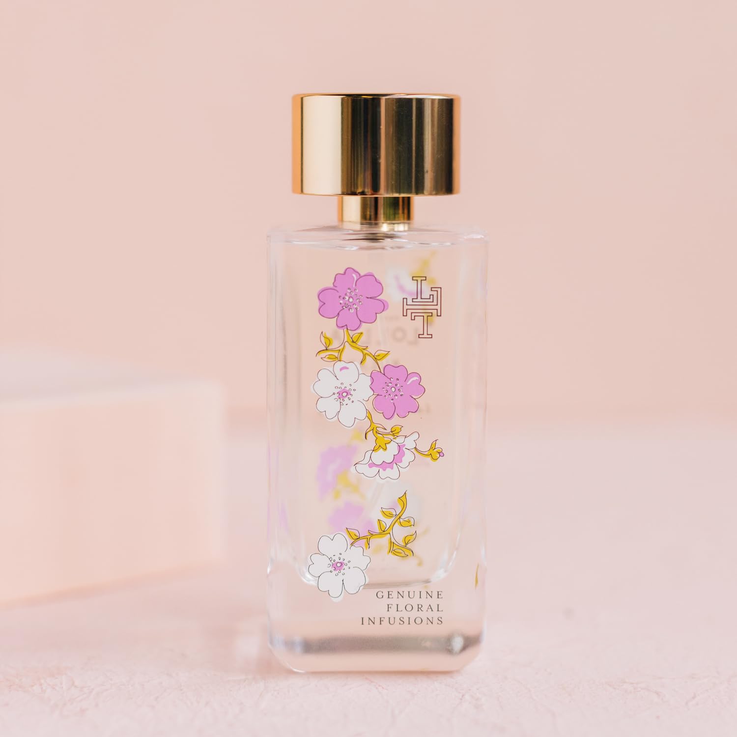 Decorative glass bottle of LOLLIA Relax elevates a luxe vanity display