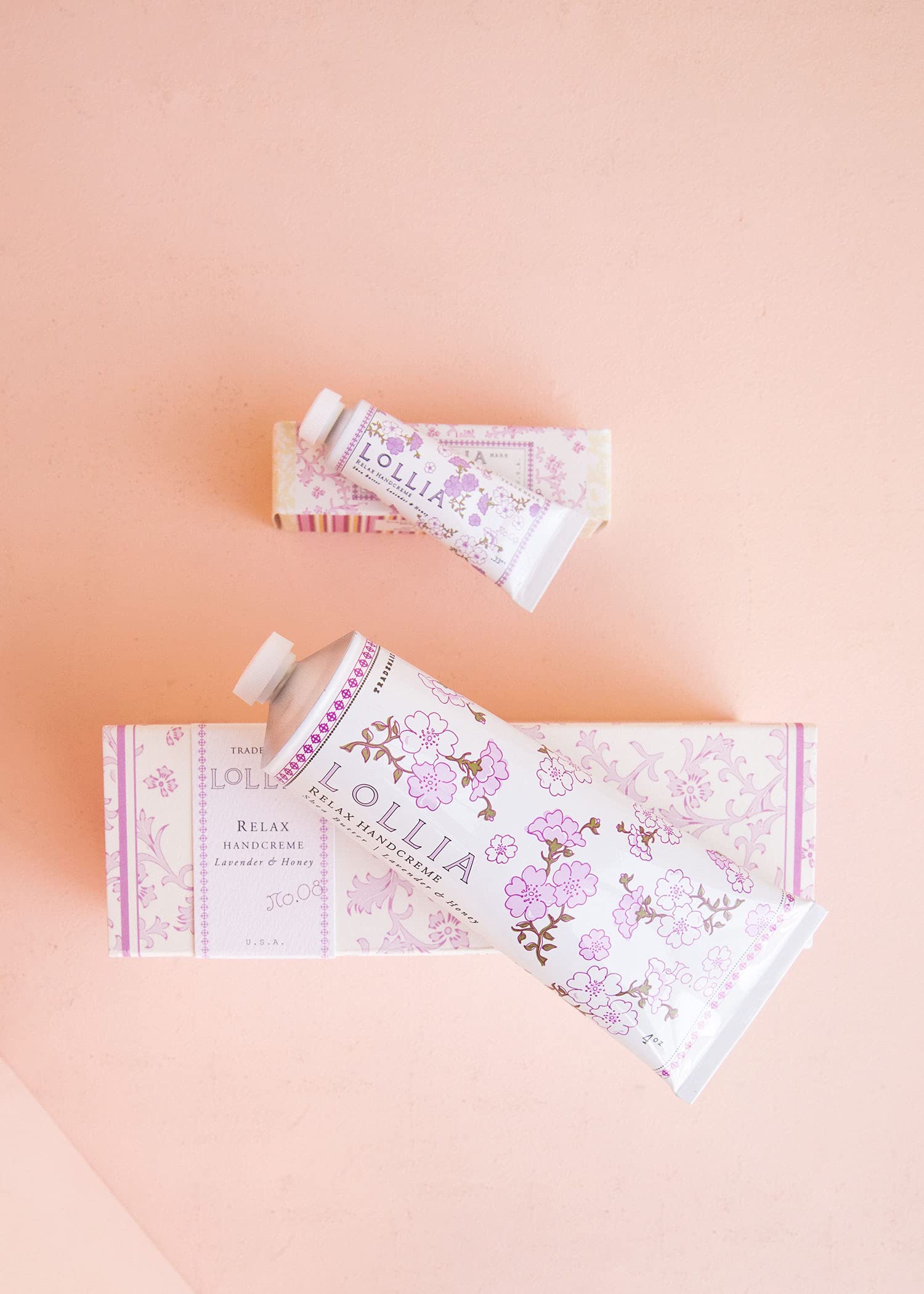 LOLLIA Relax Handcreme bottle closeup reveals creamy texture for quick absorption.
