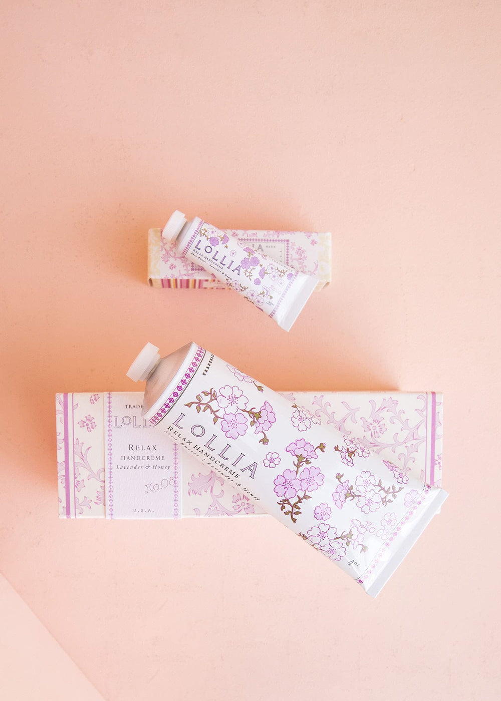 LOLLIA Relax Handcreme bottle closeup reveals creamy texture for quick absorption.