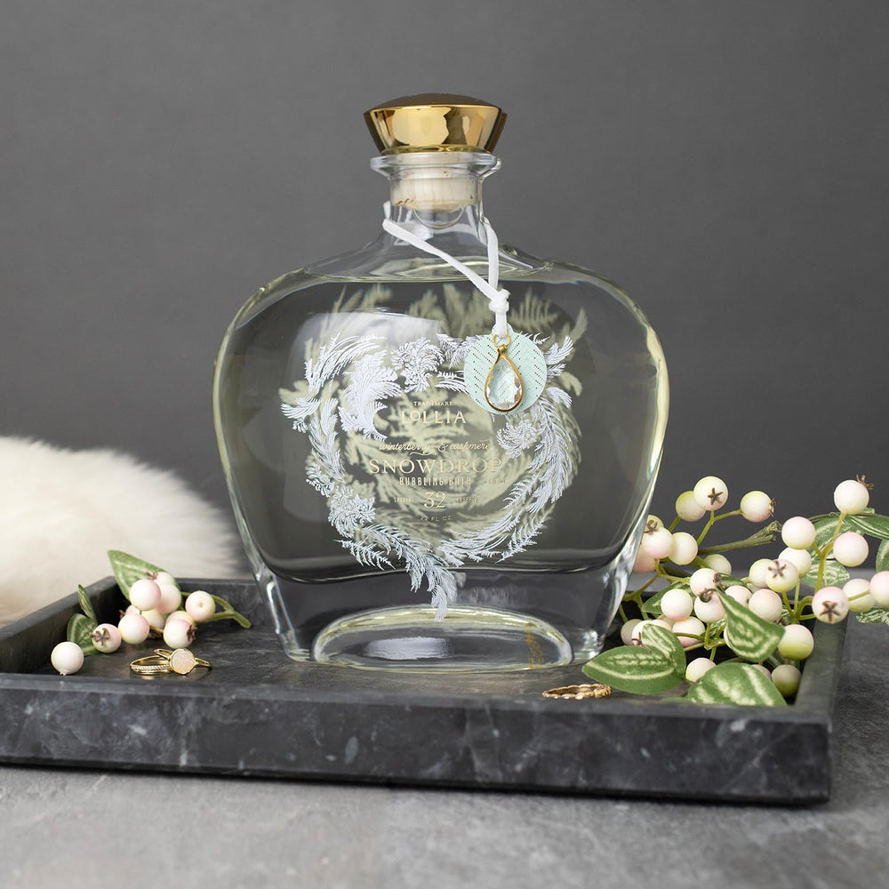 Lollia Snowdrop vanity with bottle reads luxurious skincare ritual.