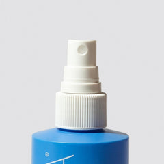 Loma leave-in conditioner detangling hair after wash for easy styling.