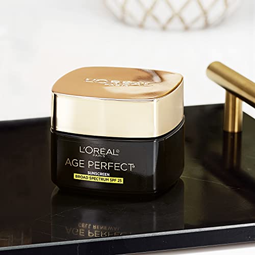 L'Oreal Paris Age Perfect glass jar resting on a light surface.