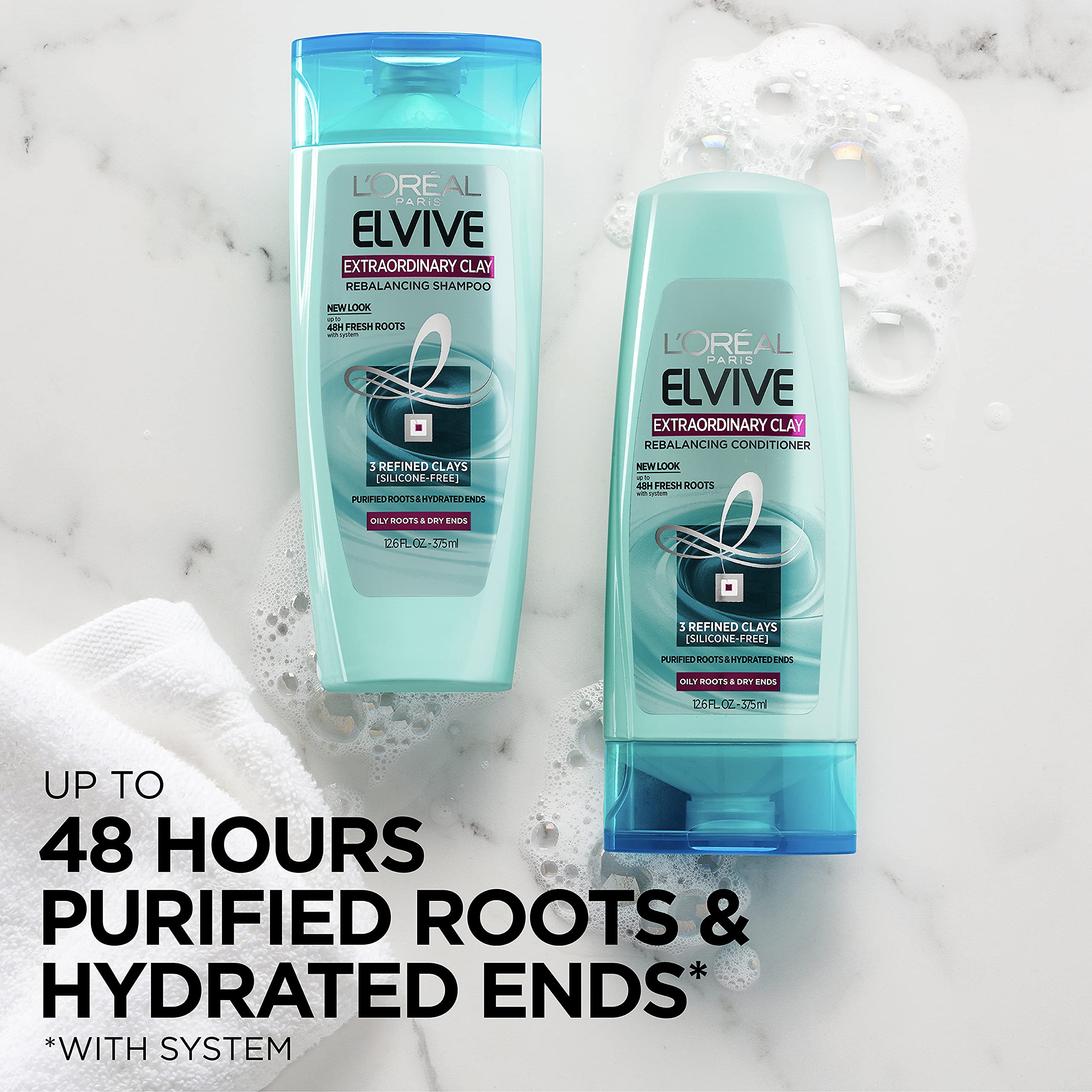 L'Oreal Paris Elvive Extraordinary Clay conditioner applying to hair ends illustrates hydrating dry lengths