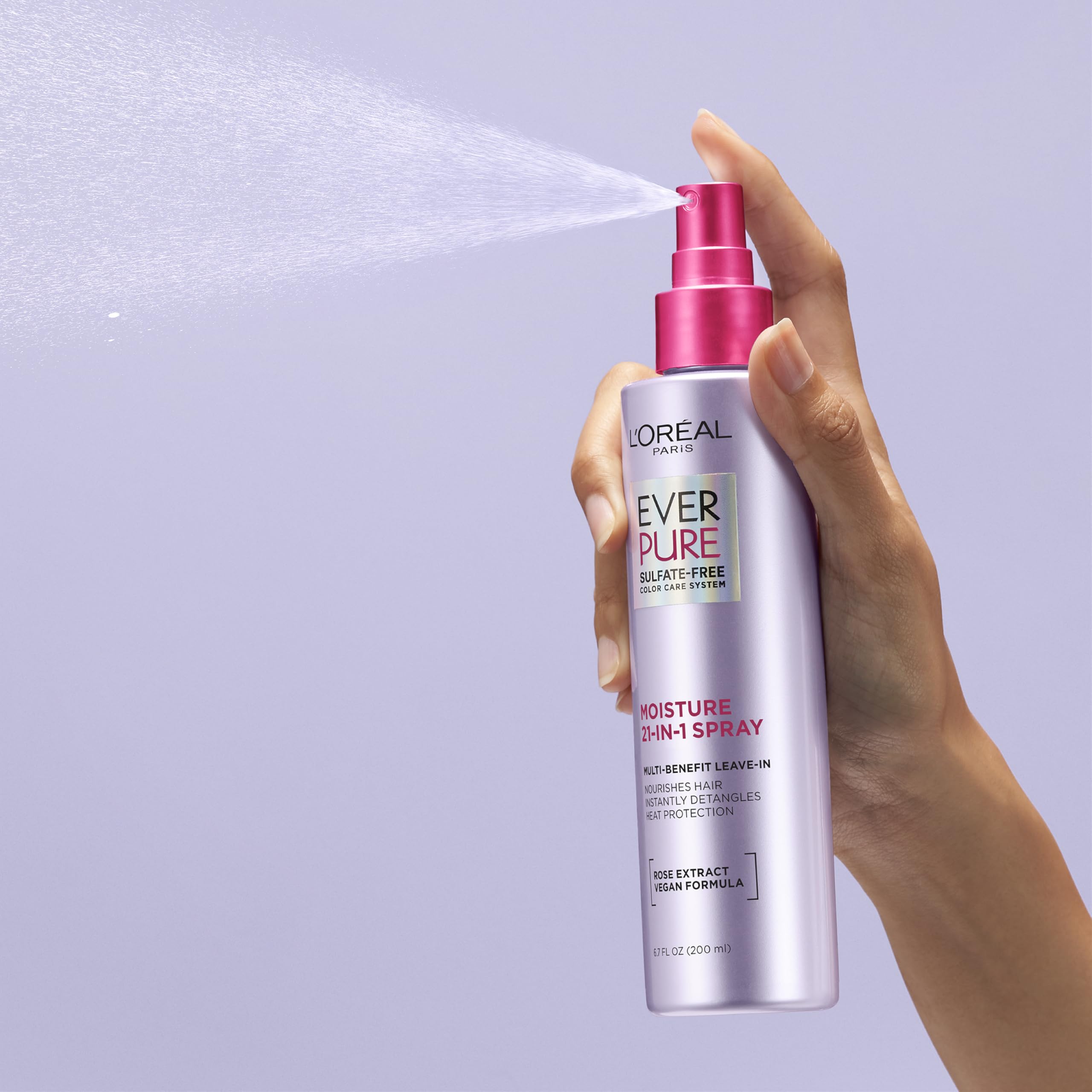 L'Oreal Paris being sprayed on damp hair for instant detangling benefit