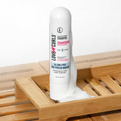 Love Ur Curls fragrance-free shampoo bottle closeup highlights vegan, silicone-free care.