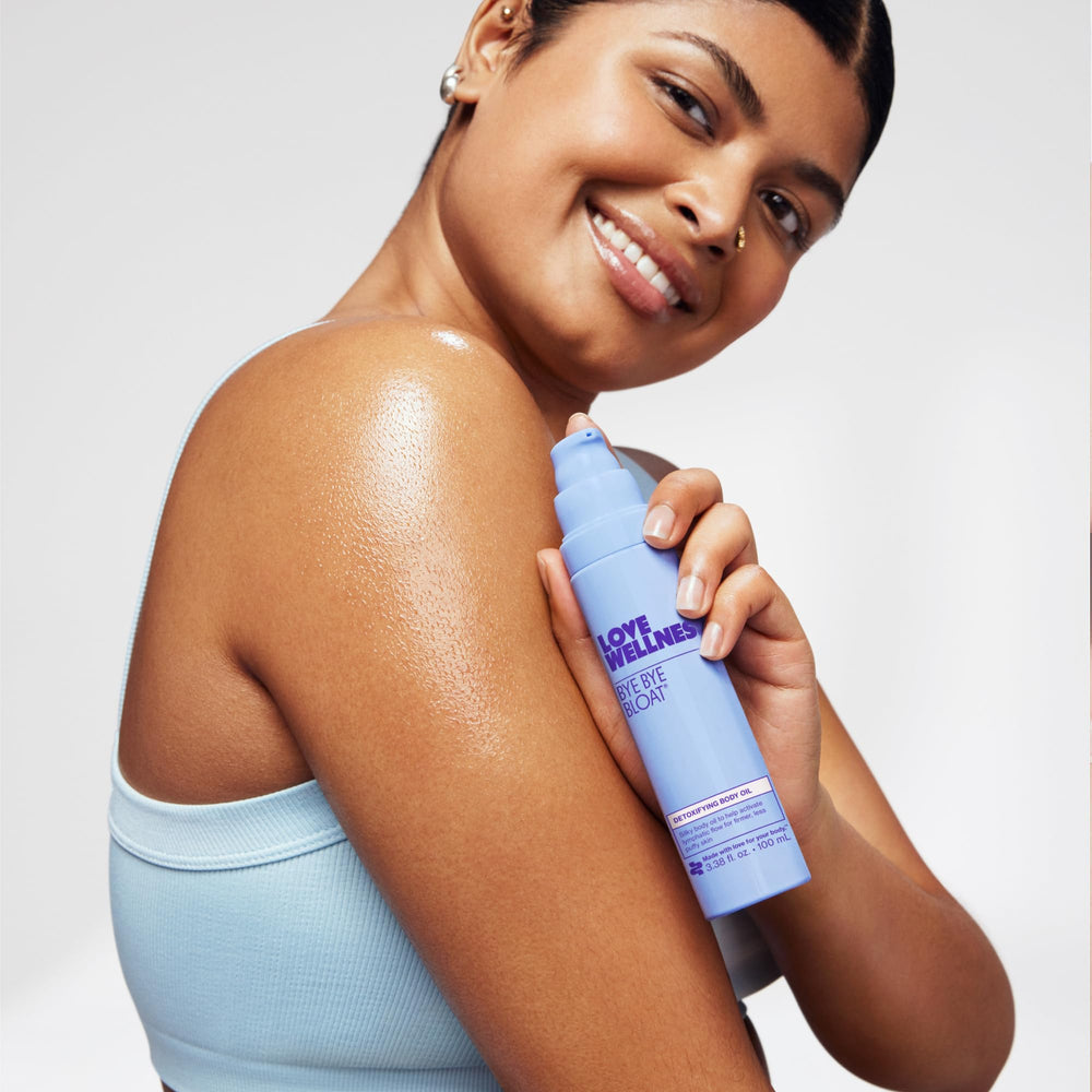 Love Wellness Bye Bye Bloat oil on skin showing improved hydration and glow.