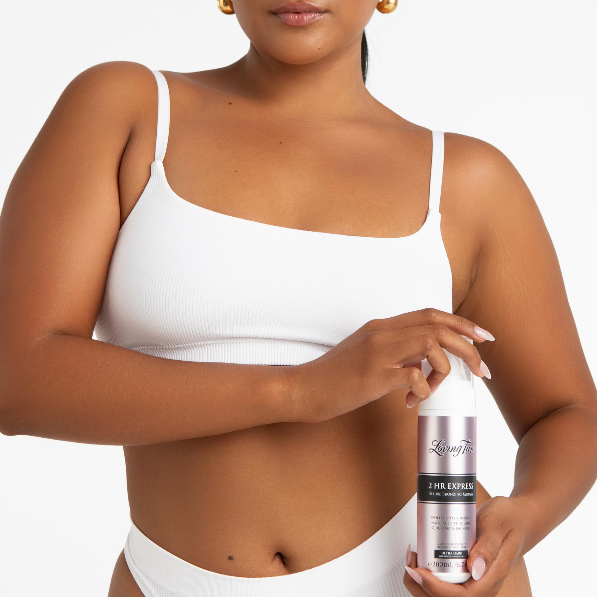 Loving Tan 2HR Express Mousse color guide helps even results during application.