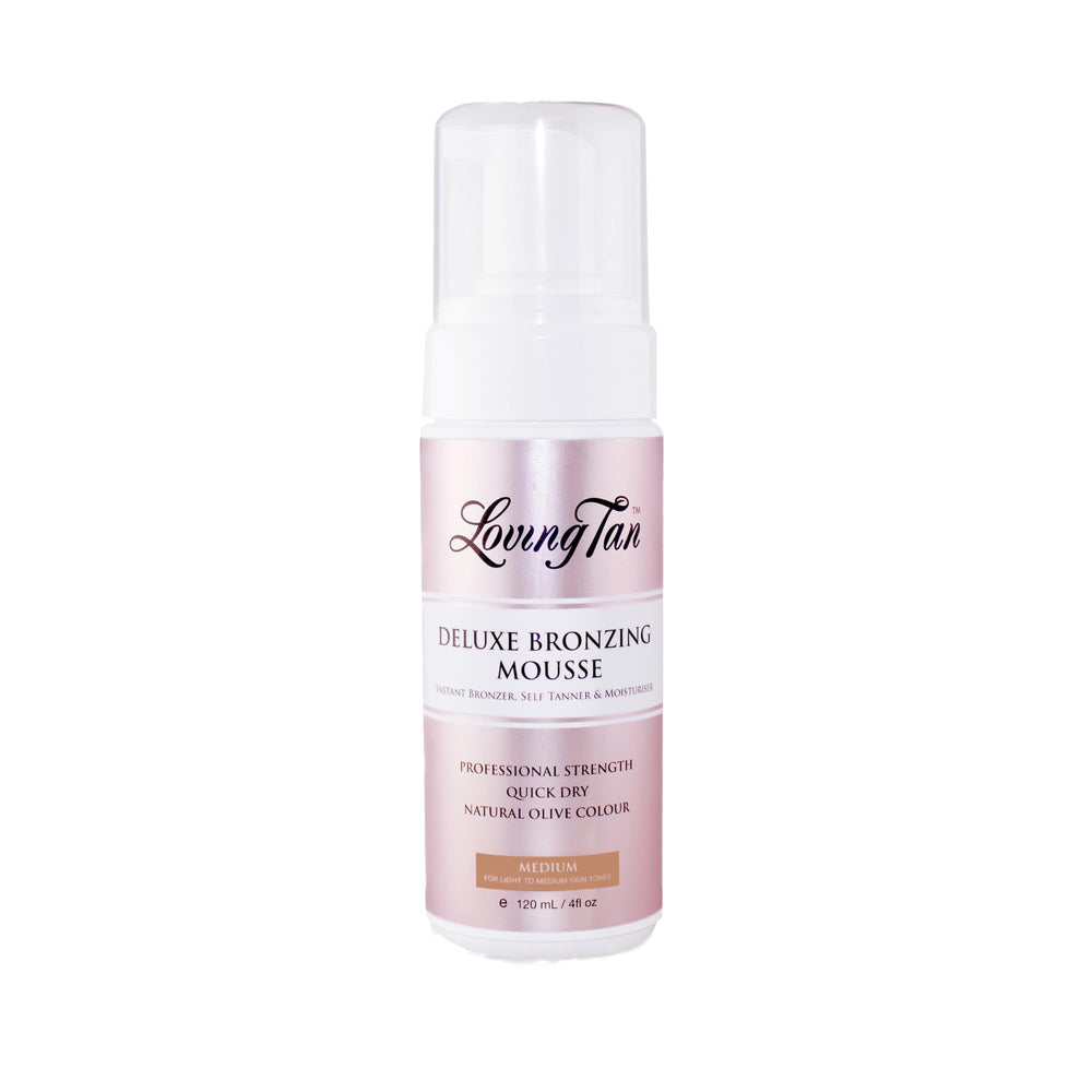 Loving Tan deluxe bronzing mousse medium bottle front shows quick-drying formula and natural-looking color