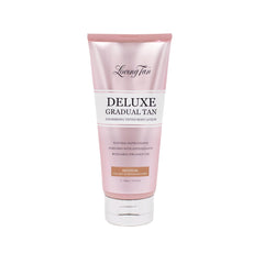 Loving Tan Deluxe Gradual Tan Lotion bottle image shows natural color build for a seamless glow.