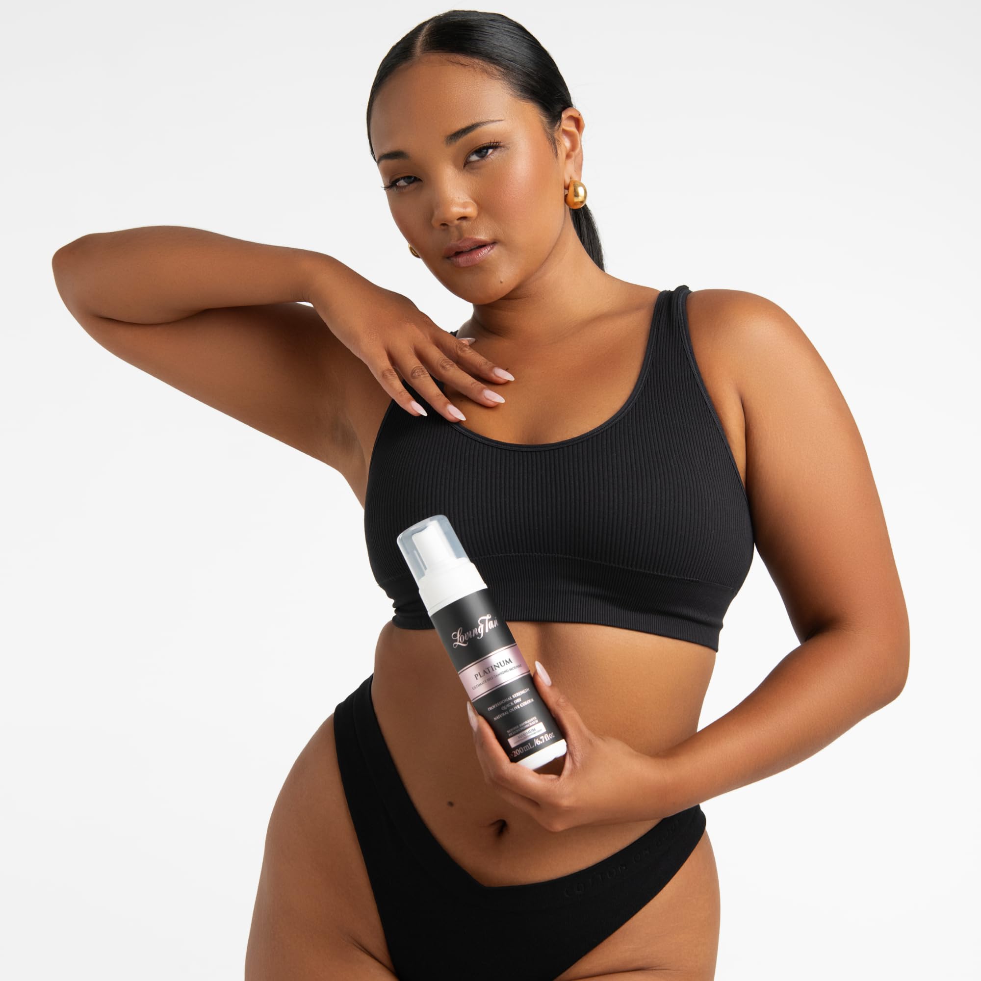 Loving Tan Platinum Mousse texture close-up shows airy, quick-drying foam.