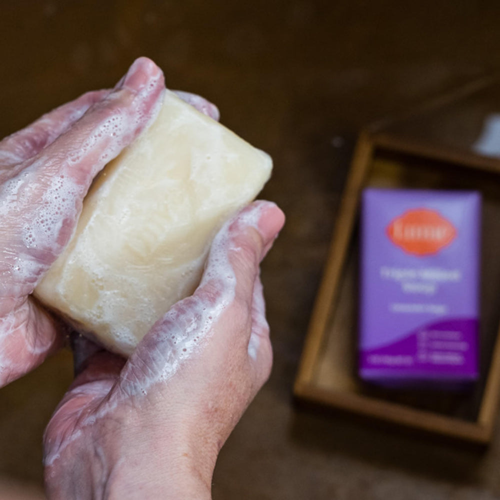 Lume bar soap close-up shows creamy lather and minimal air.