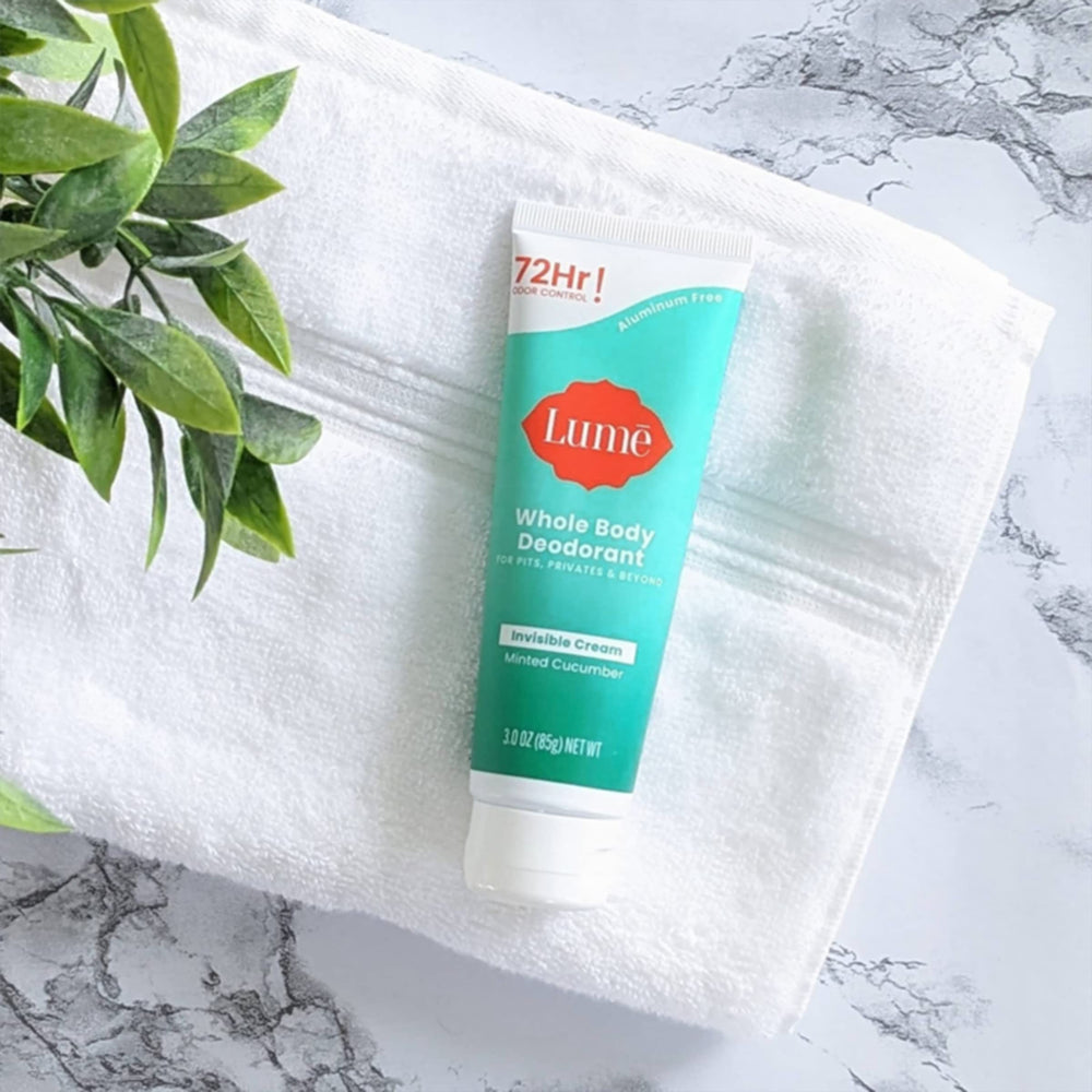 LUME Whole Body Deodorant invisible-cream-tube-application shows pea-sized amount for targeted use.