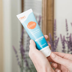 Lume Whole Body Deodorant invisible cream tube cap-off close-up showing clean unscented application for sensitive skin areas