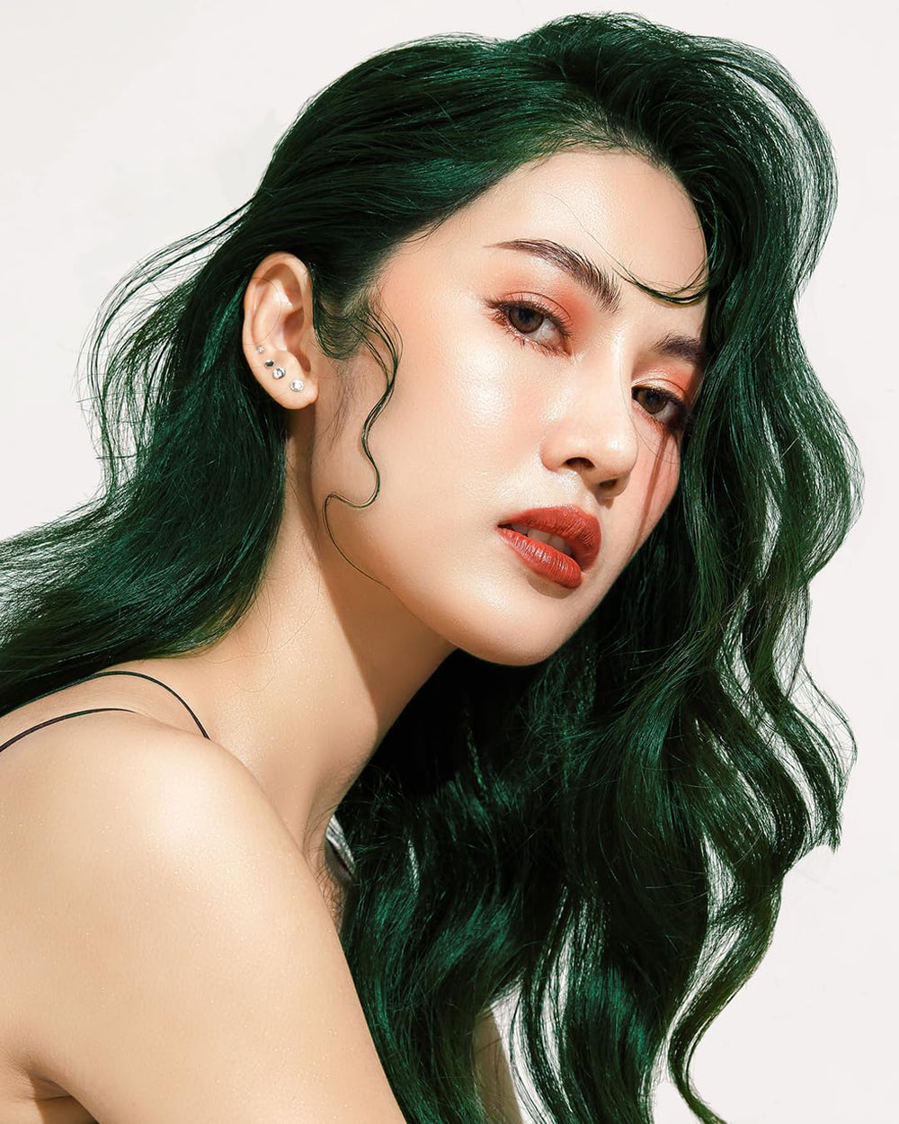 Lunar Tides Juniper hair result on model demonstrates color depth and fade-friendly look