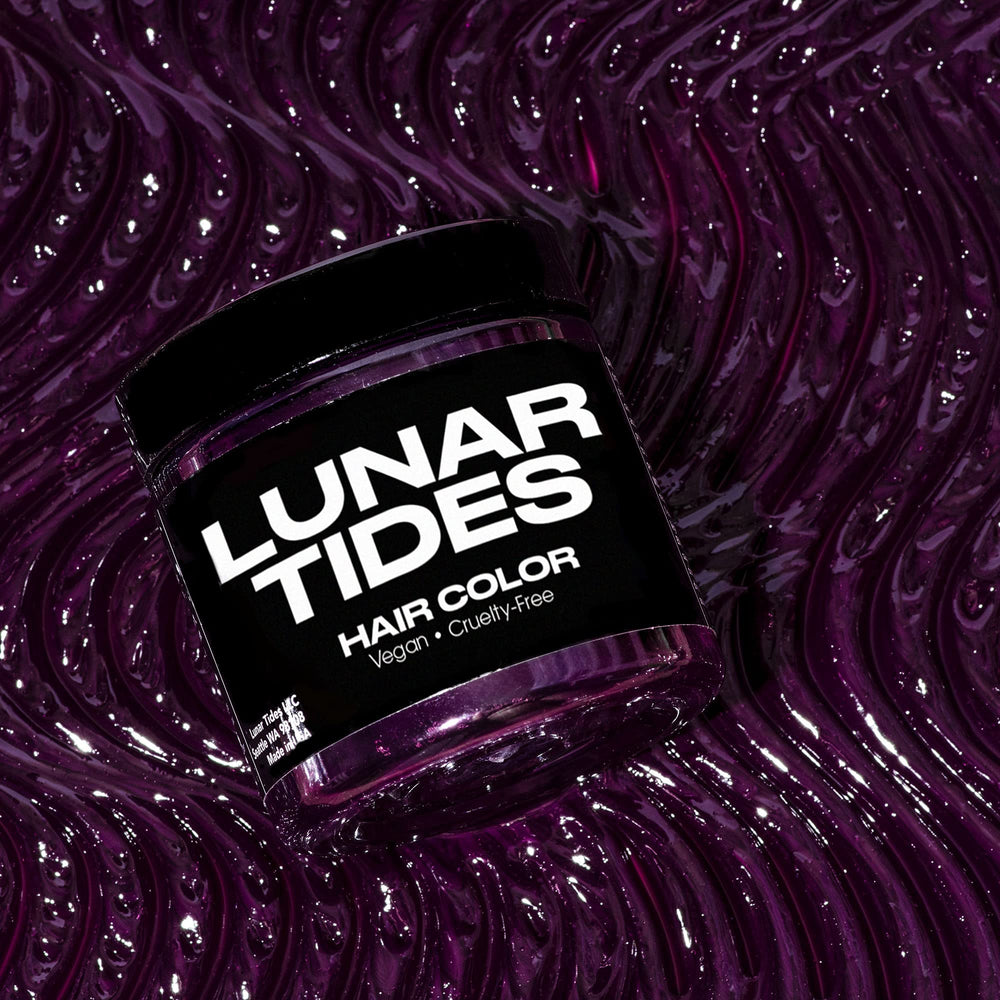 Lunar Tides Plum Purple during application with gloves for salon-ready color at home.