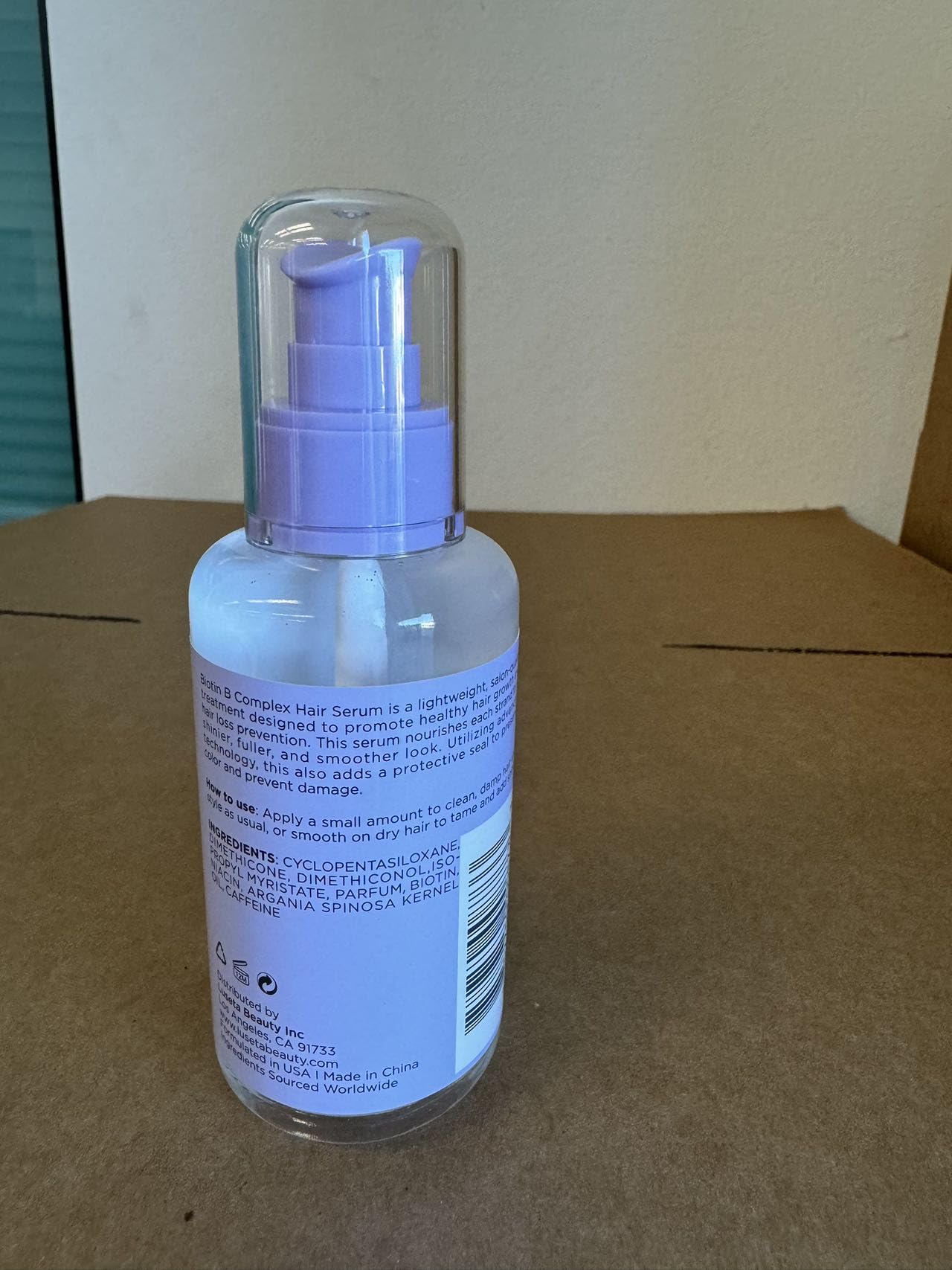 Luseta Biotin B-Complex Hair Oil application scene shows scalp massage for improved absorption