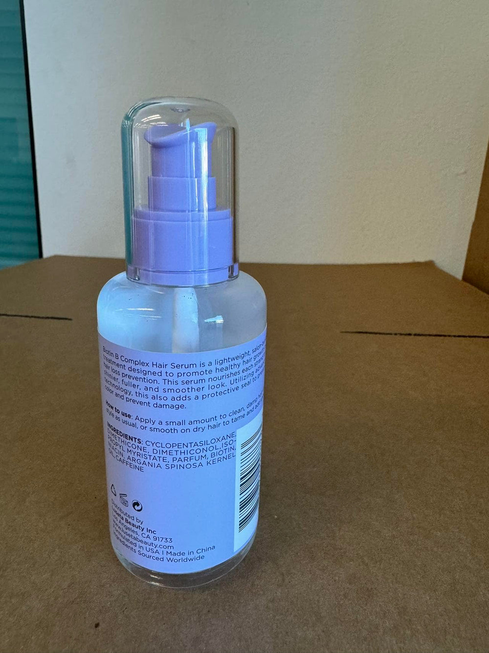 L LUSETA Biotin B-Complex Hair Oil application on scalp nourishes roots.