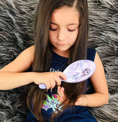 LUV HER hairbrush with ergonomic handle supports easy brushing for ages 3 and up.