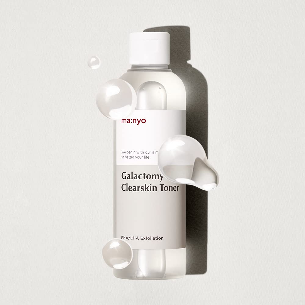 ma:nyo Galactomy Clear Skin Toner bottle with soft lighting in bathroom