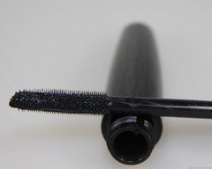 MAC Extreme Dimension 3D lash pigment closeup shows rich black color for definition.