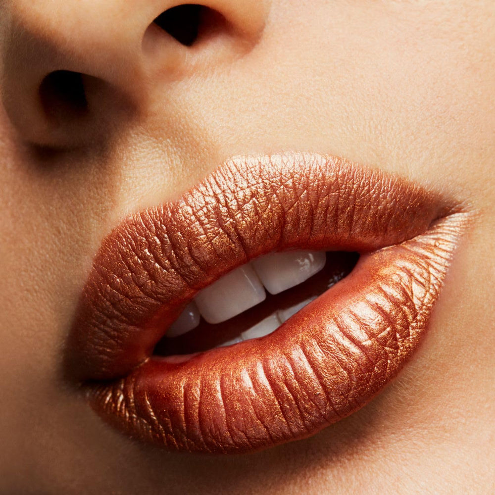 MAC Frost Lipstick Bronze Shimmer closeup emphasizes color payoff and glossy finish.
