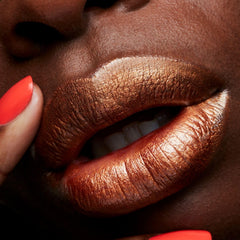 MAC Frost Lipstick Bronze Shimmer swatches reveal rich color and pearl finish.