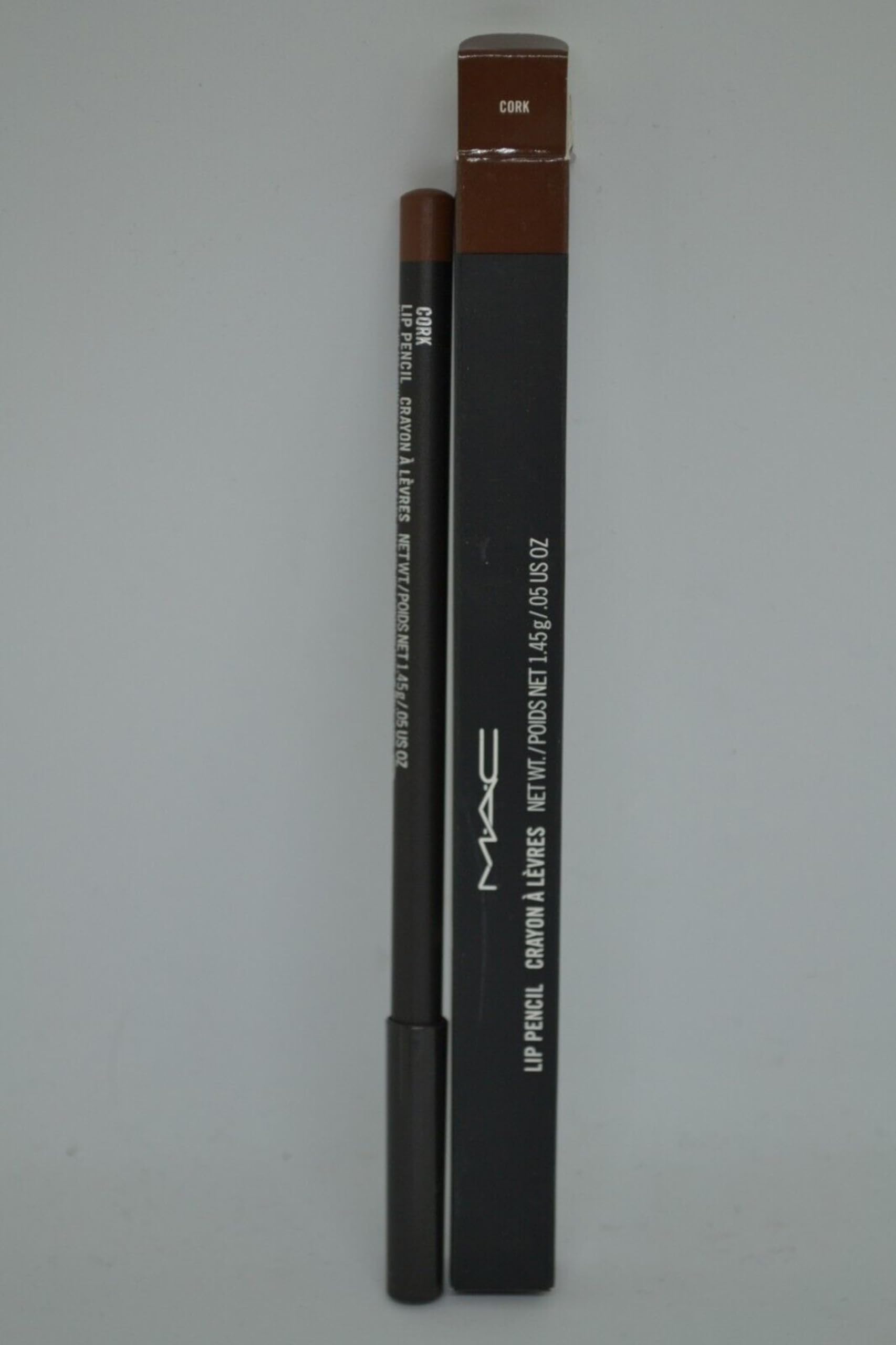 MAC Lip Pencil Cork with lipstick nearby demonstrates extended wear base for longer-lasting color.