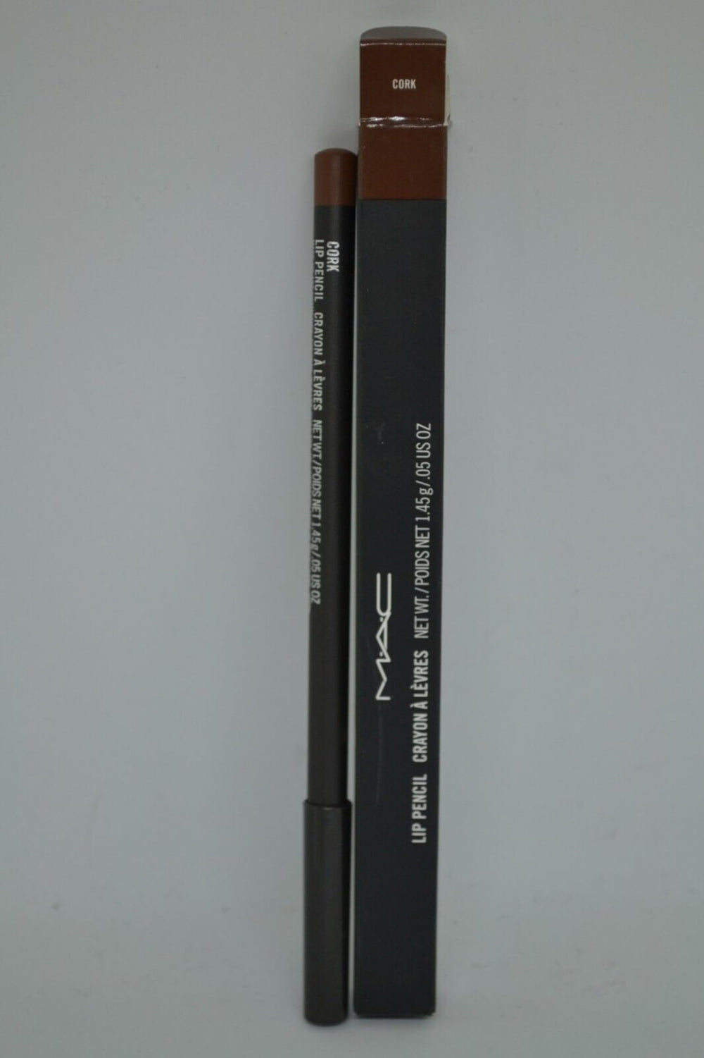 MAC Lip Pencil Cork with lipstick nearby demonstrates extended wear base for longer-lasting color.