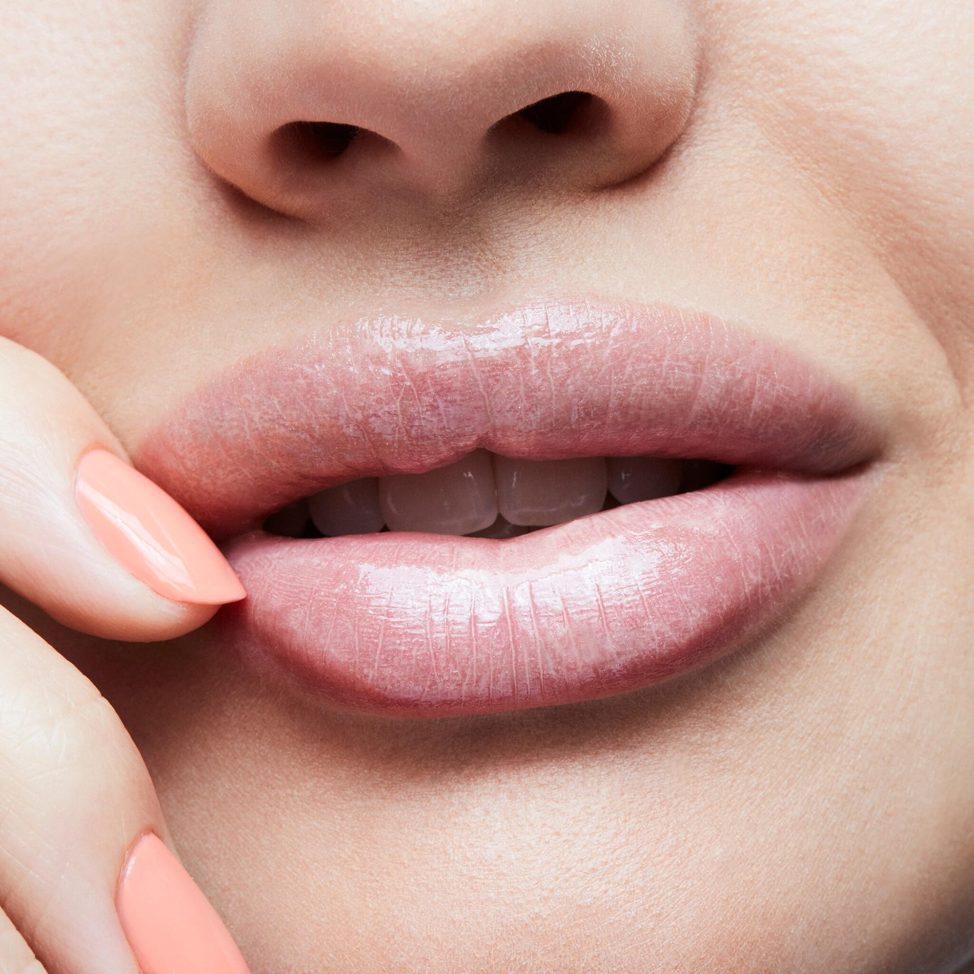 MAC Lipglass C-Thru soft nude-beige shade suits many skin tones.