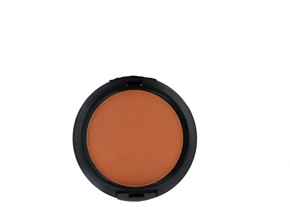 MAC Studio Fix Powder Plus Foundation NW43 closeup reveals silky, smooth texture.