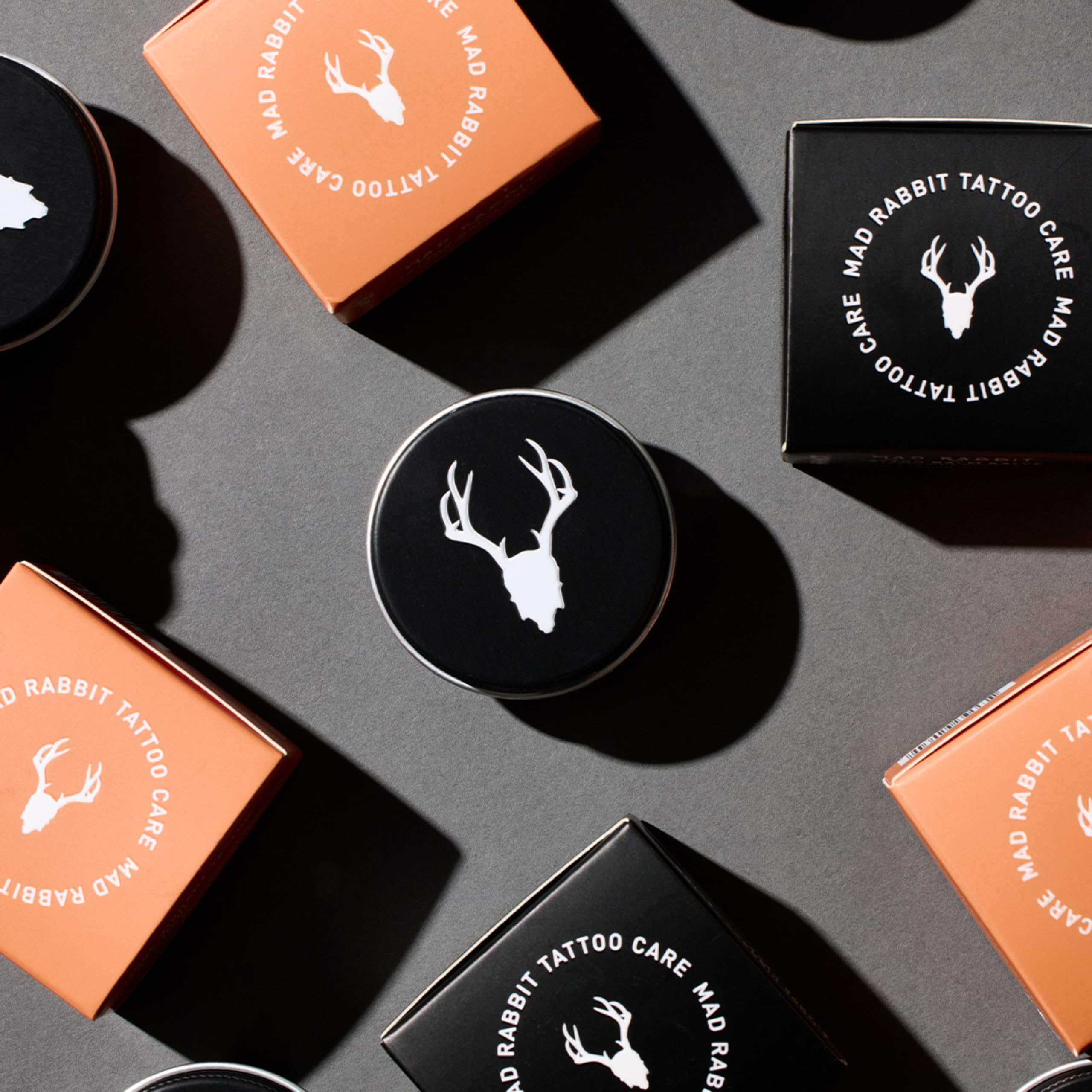Mad Rabbit Tangerine & Vanilla Balm packaging on shelf with sun-kissed scent notes.