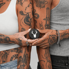 Mad Rabbit Tattoo Balm being rubbed on skin during application