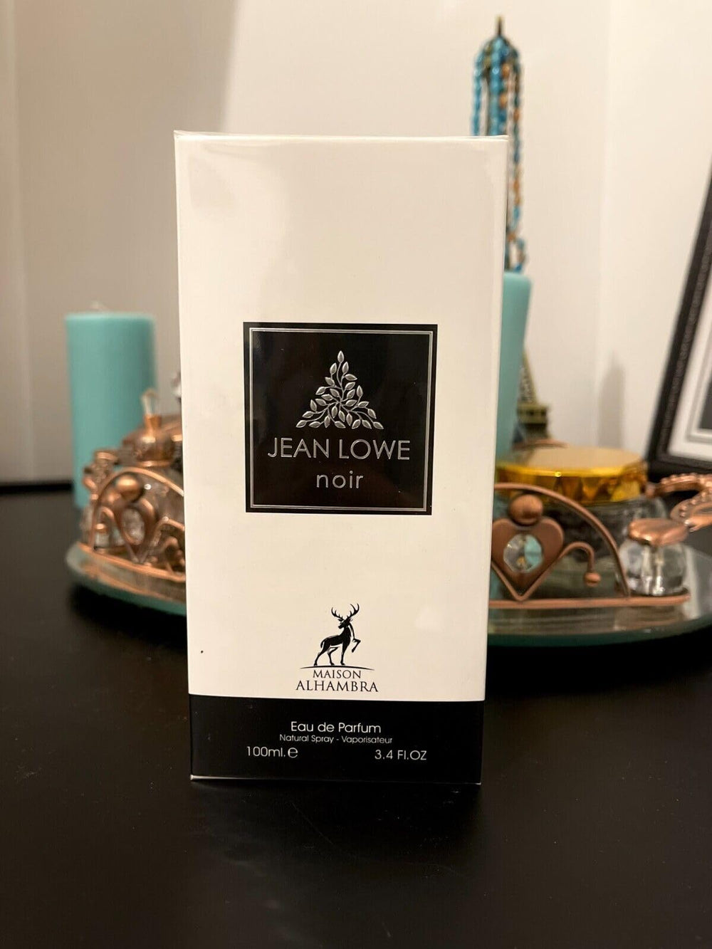 Maison Alhambra Jean Lowe Noir cap close-up shows premium packaging