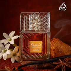 Maison Alhambra Khamrah bottle tilt reveals warm amber tones for evening sillage.