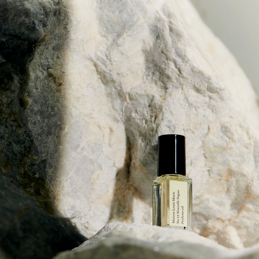 Maison Louis Marie No.13 Nouvelle Vague roll-on application on skin for quick scent release.