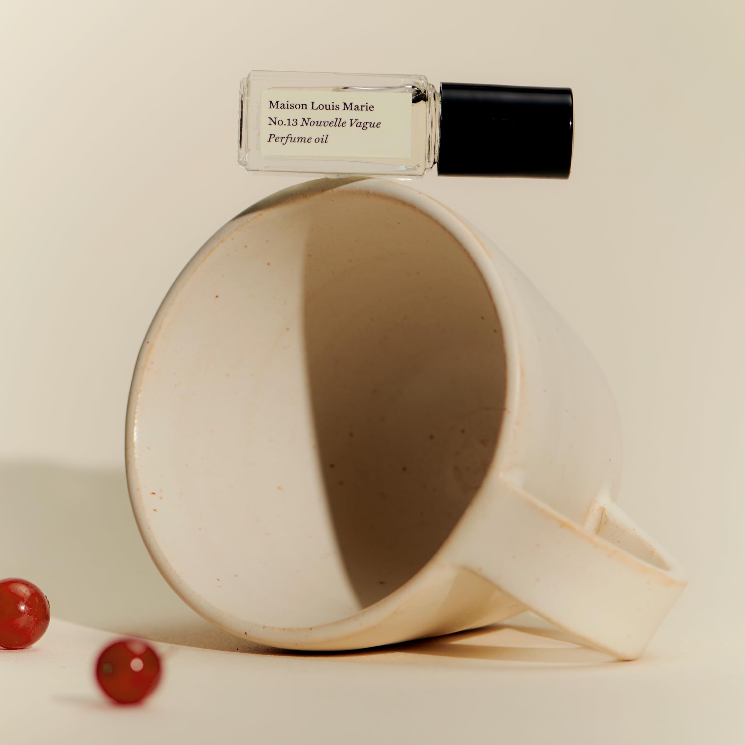 Maison Louis Marie No.13 Nouvelle Vague packaging shot emphasizing luxury clean beauty.
