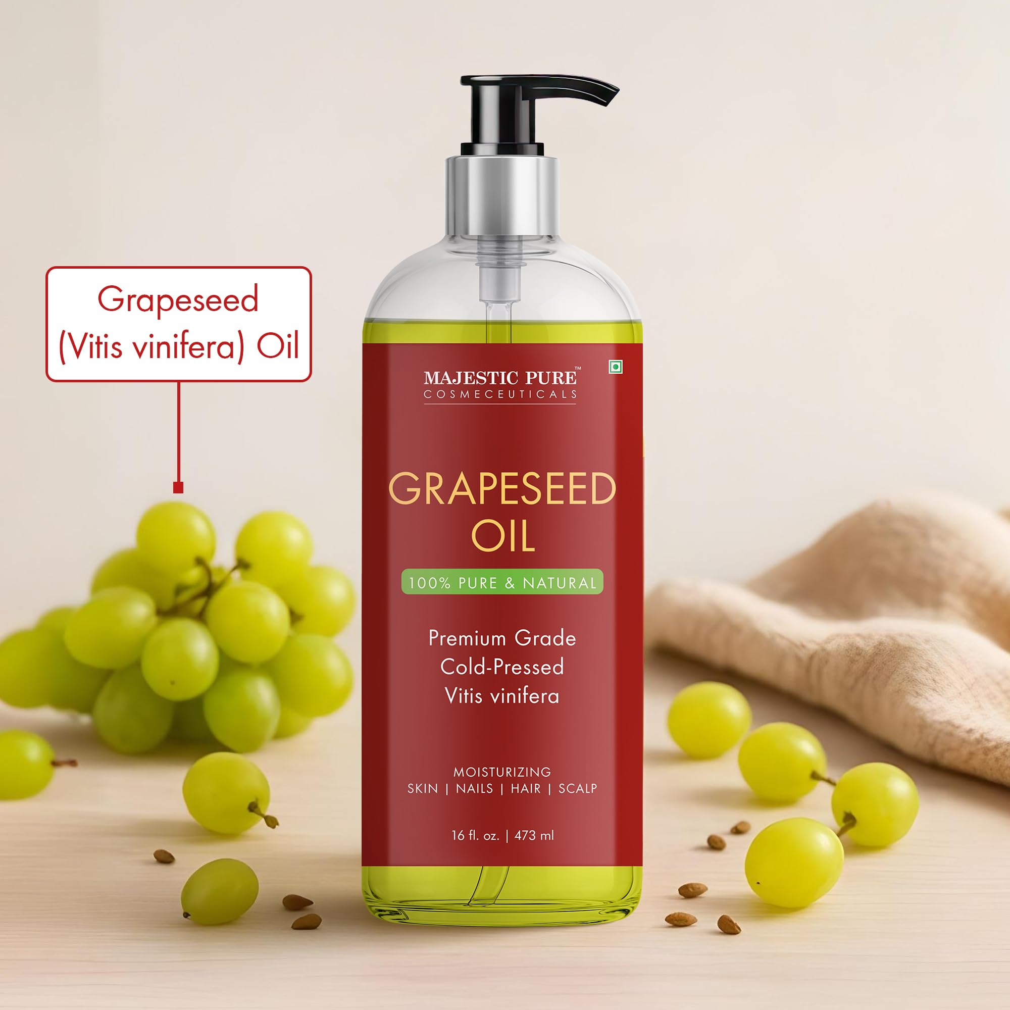 Majestic Pure grapeseed oil pour shot highlighting quick absorption for on-the-go use.